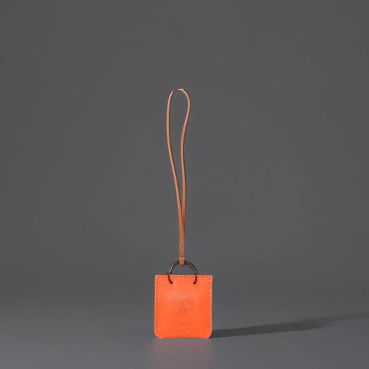 HERMES Milo Lambskin Swift Shopping Bag Charm Feu Gold